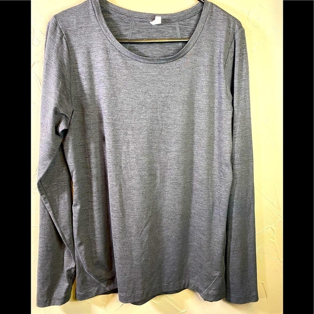 Not sure what label as it has faded. Size L grey athletic shirt